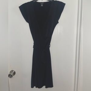 Black dress with a tie upfront. Cross over V neck.